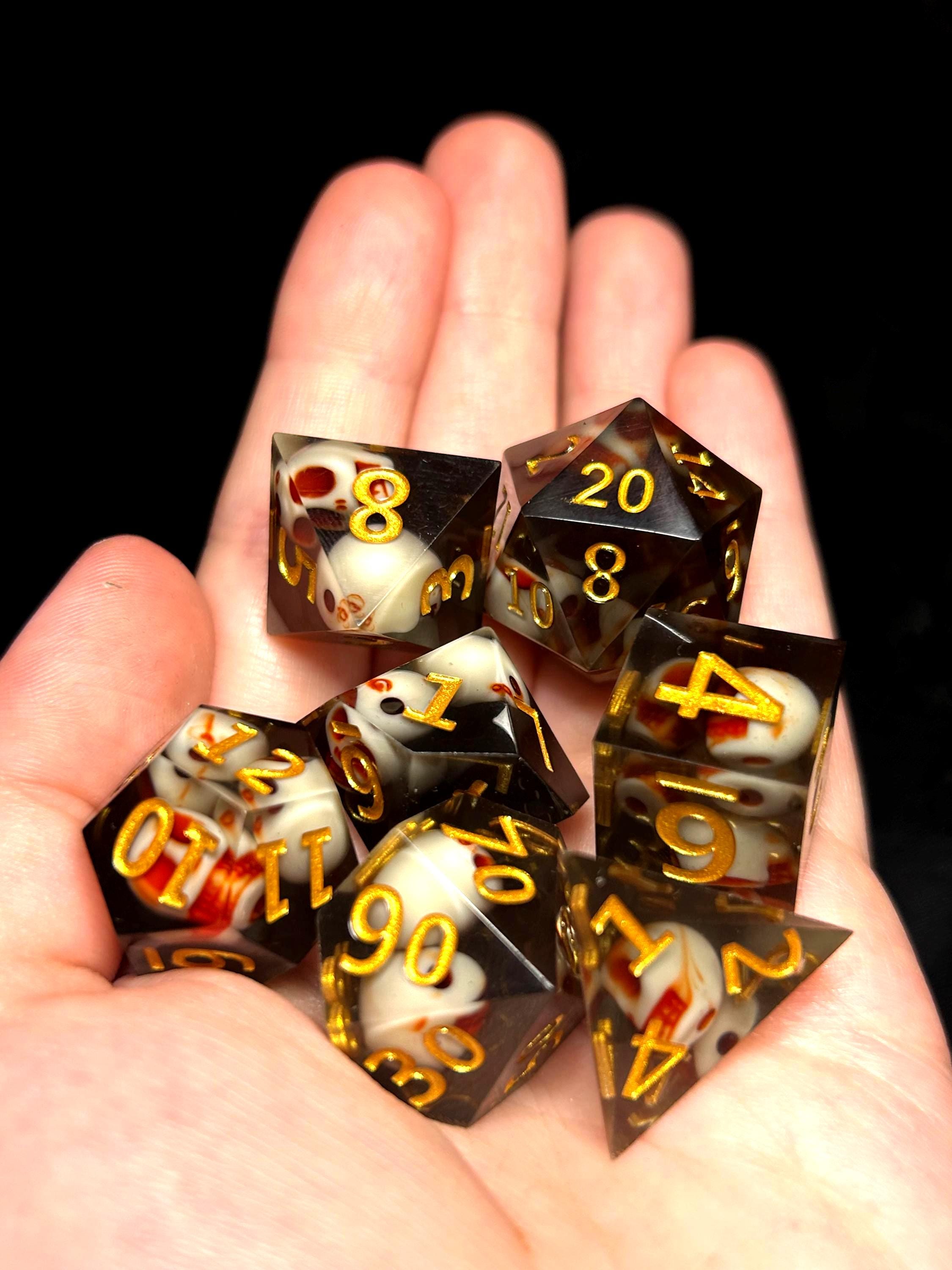 Gilded Ossuary | Sharp Edge DnD Dice Set | Luxury Skull Resin Dice with Gold Ink | Dark Fantasy 7pc RPG Dice for D&D and TTRPGs
